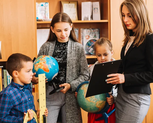 Children exploring stories together in class